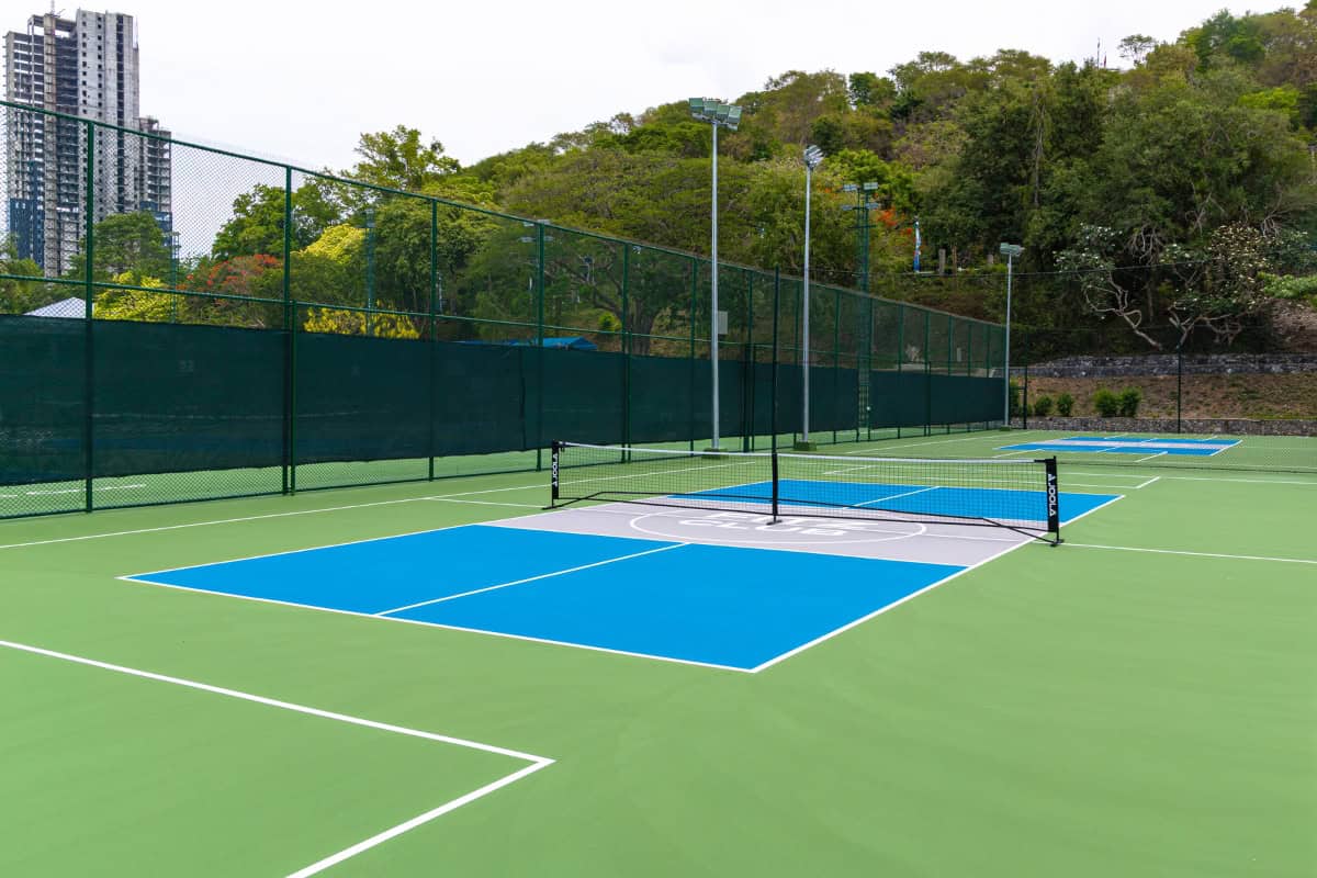 flood-lit tennis courts at luxury sports center in pattaya