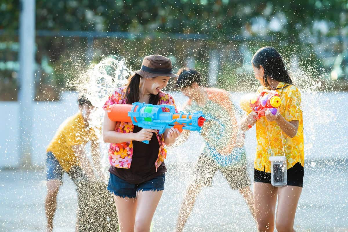 people playing with water guns during songkran in pattaya 2026